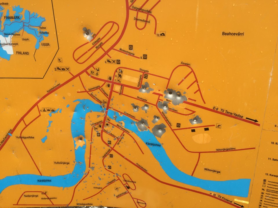 Road side map with bullet/shotgun pellet holes, a little concerning