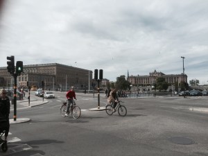 Cyclists abound - parliament building in background