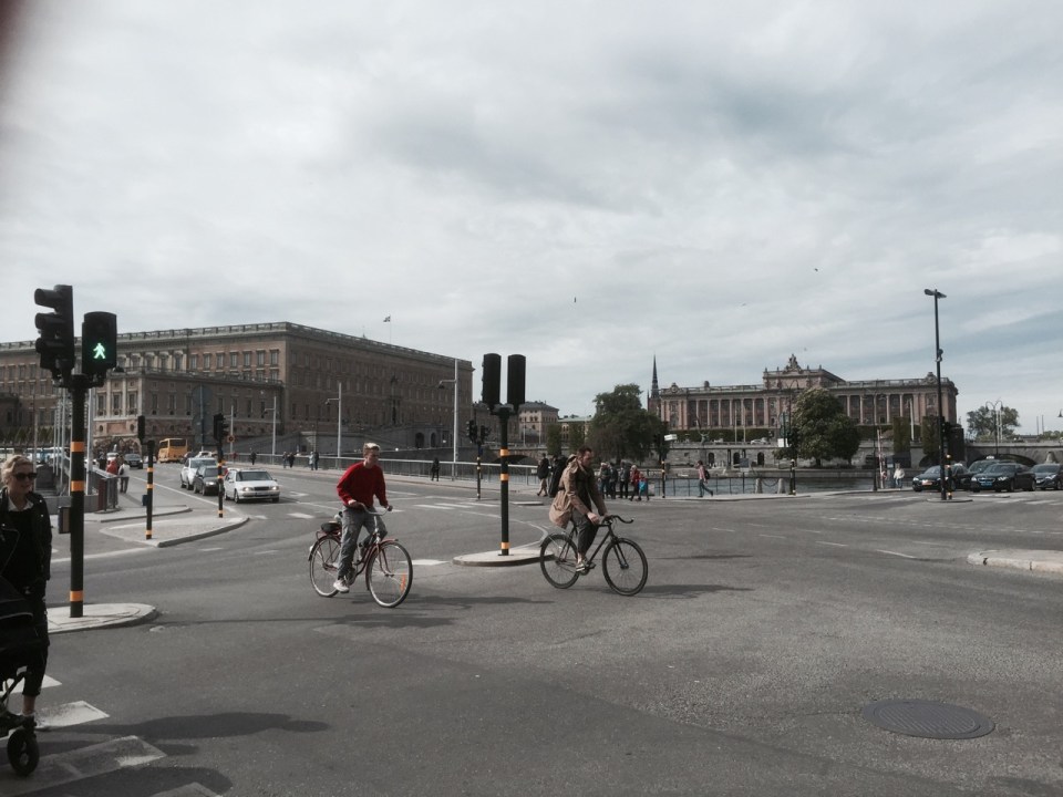 Cyclists abound - parliament building in background