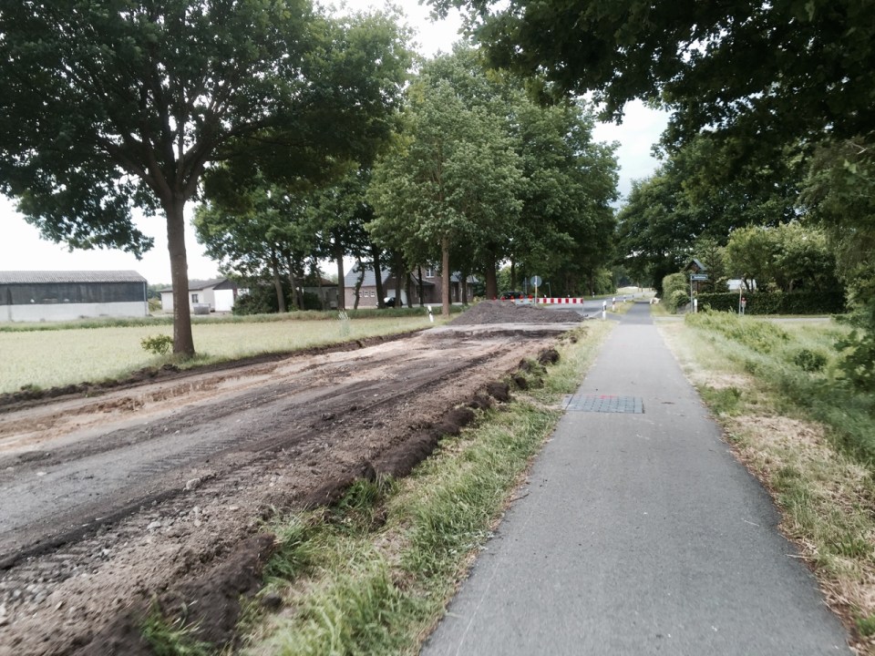 Road being resurfaced but cycle path open