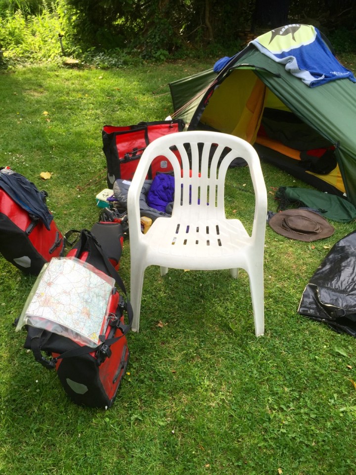 Campsite owner brought me chair - massive luxury for a cycle tourer
