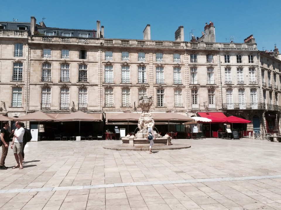 Another square with shaded restaurants
