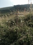 People leave homemade crosses at the top of the pass