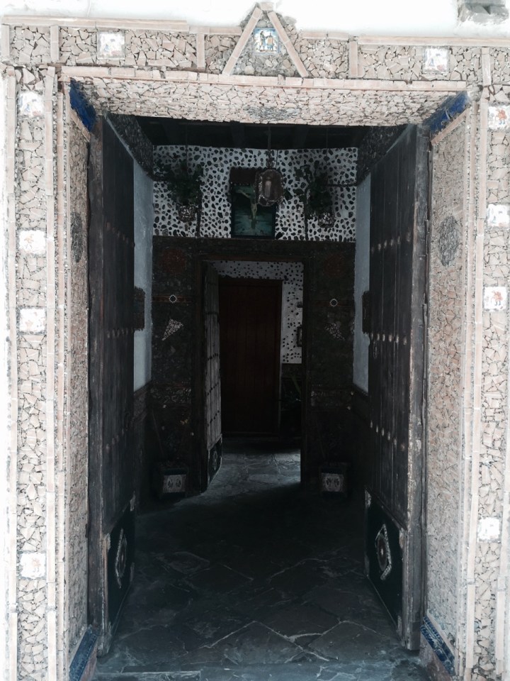 Shaded entranceway to building in old town