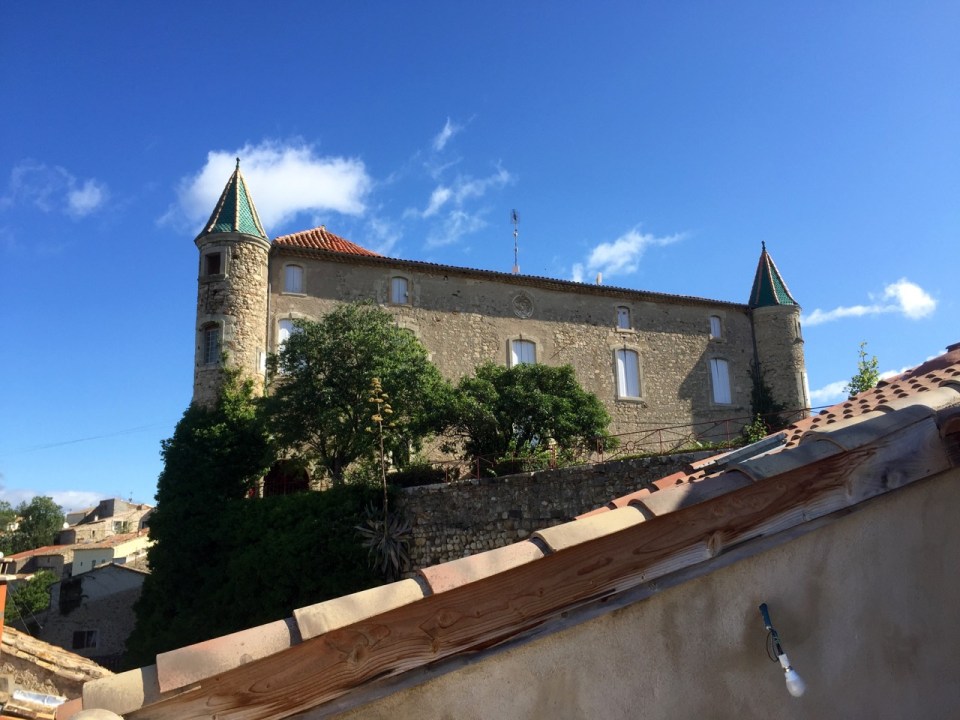 View from roof patio to chateau type building
