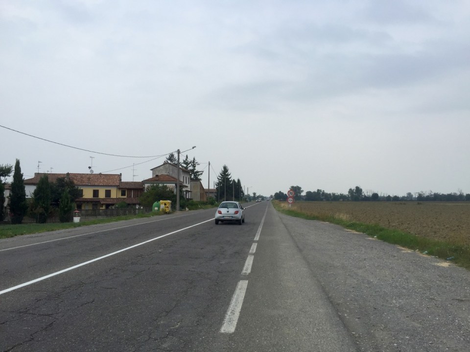 Road very flat, through farmland heading East