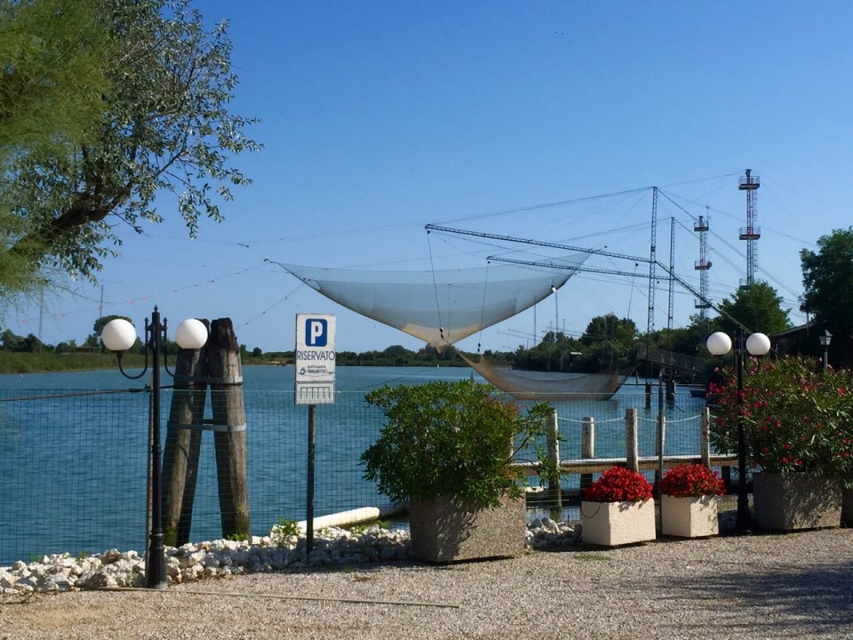Fishing nets suspended above river