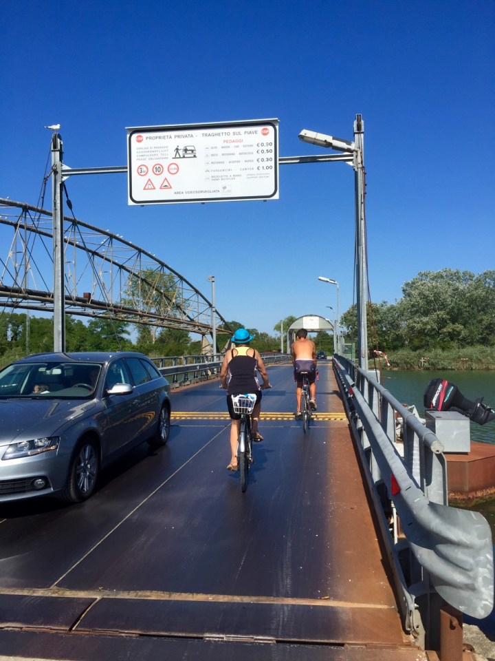 Private metal bridge over river; free for cyclists