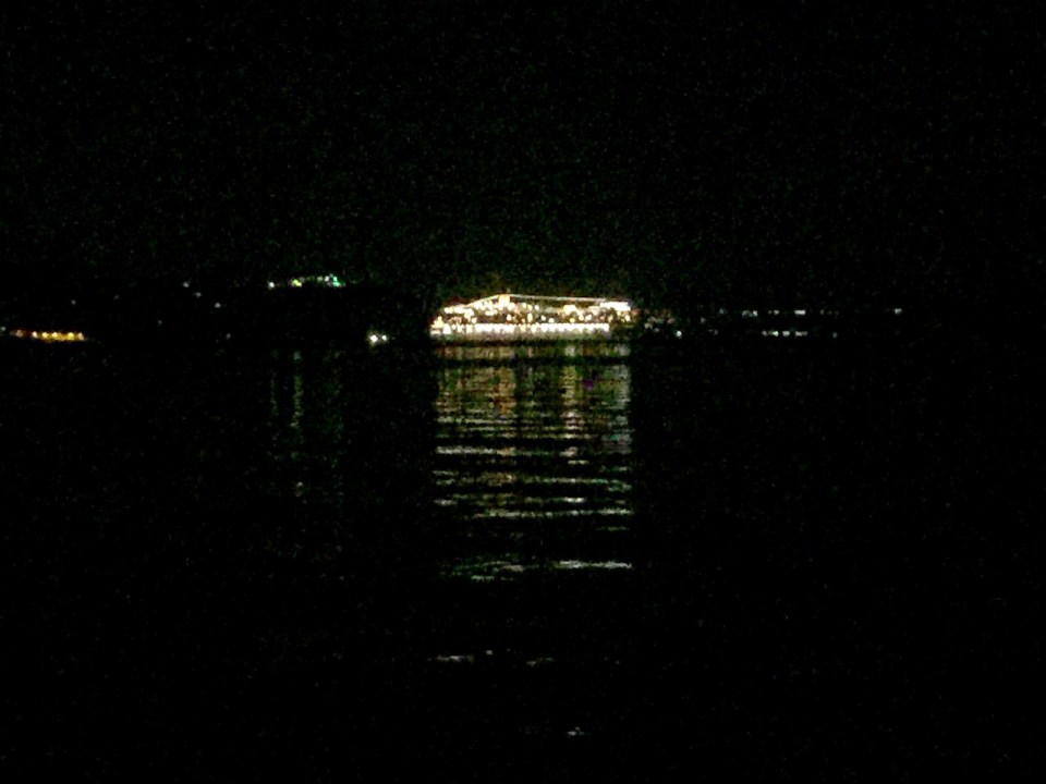Cruise ship all lit up, heading out to sea