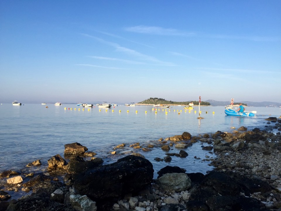 Breakfast on the beach; few people getting their boats ready