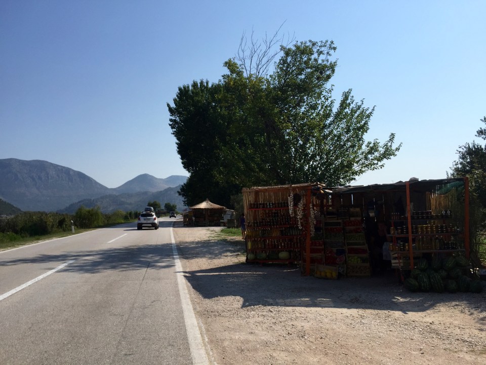 Roadside farm produce stall 2 - garlic strings