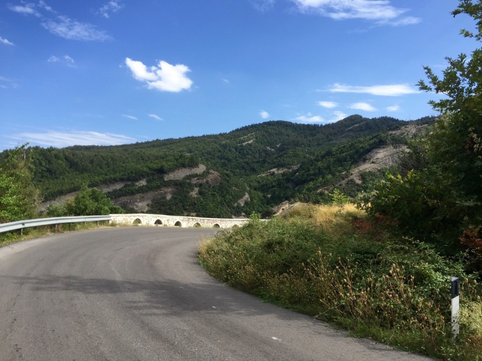Road snaking up mountainside; lots of switchbacks