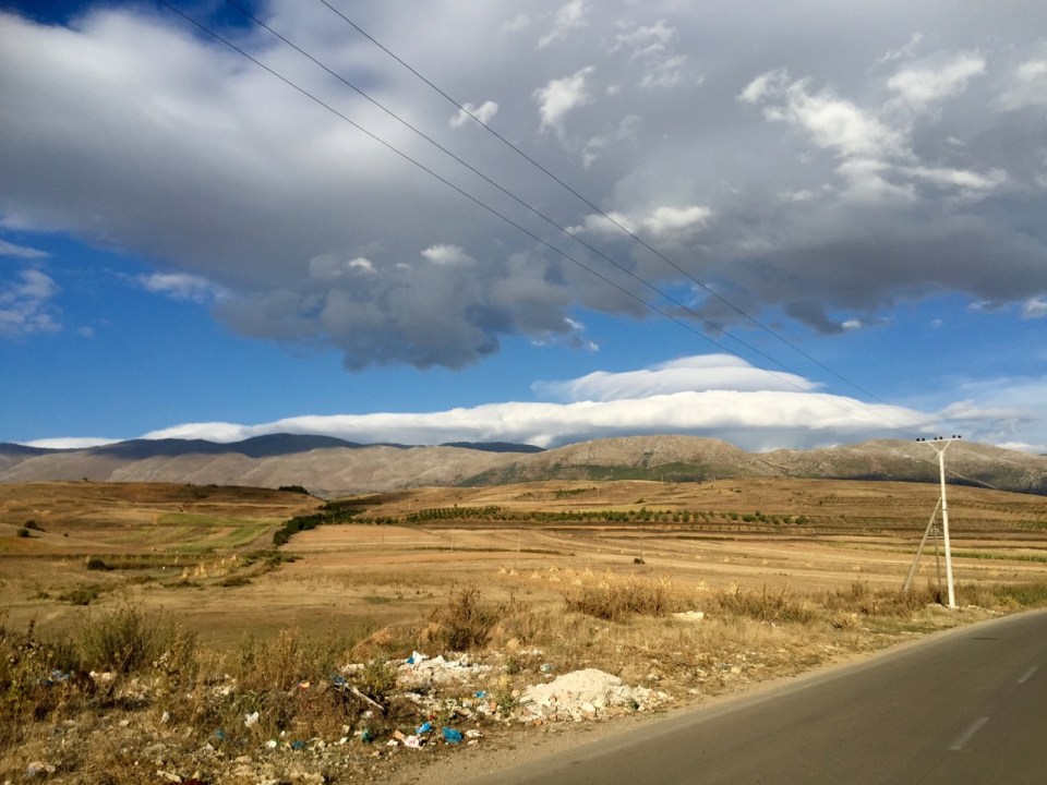 Interesting clouds over the mountains - lens?