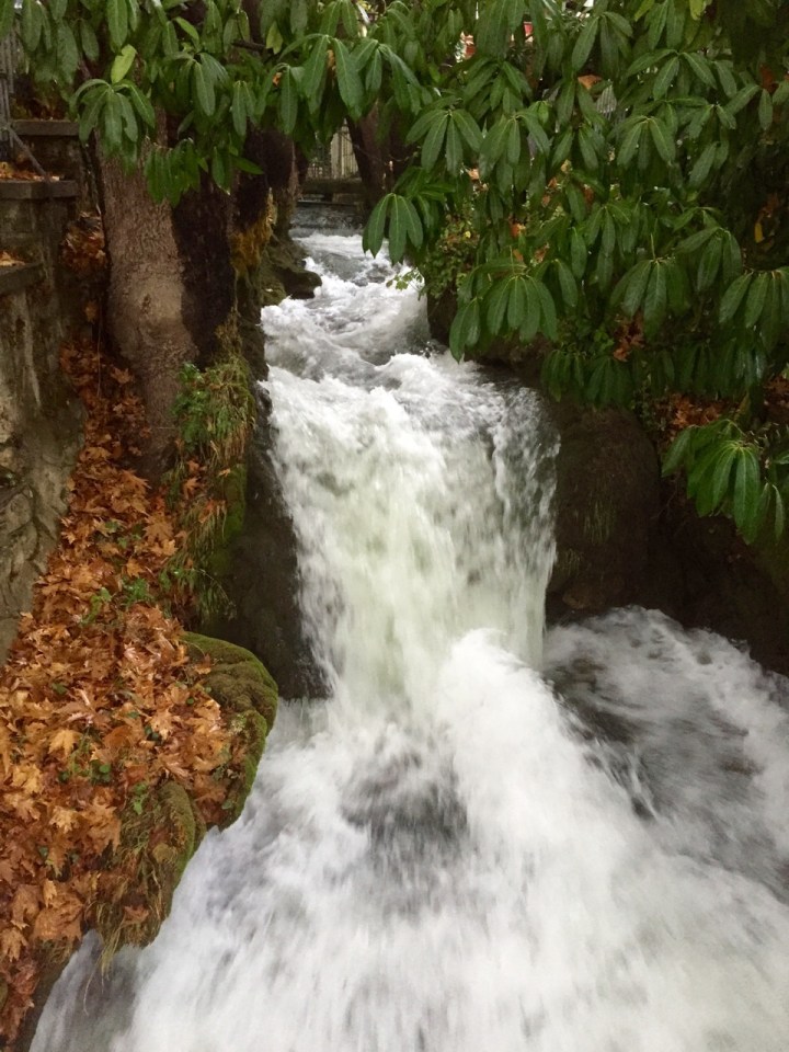 Water flowing pretty fast towards waterfall