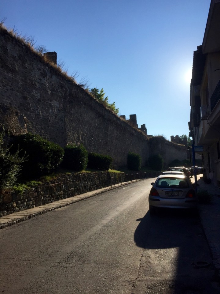 Pedalling up the hill in Thessaloniki, alongside the old city wall