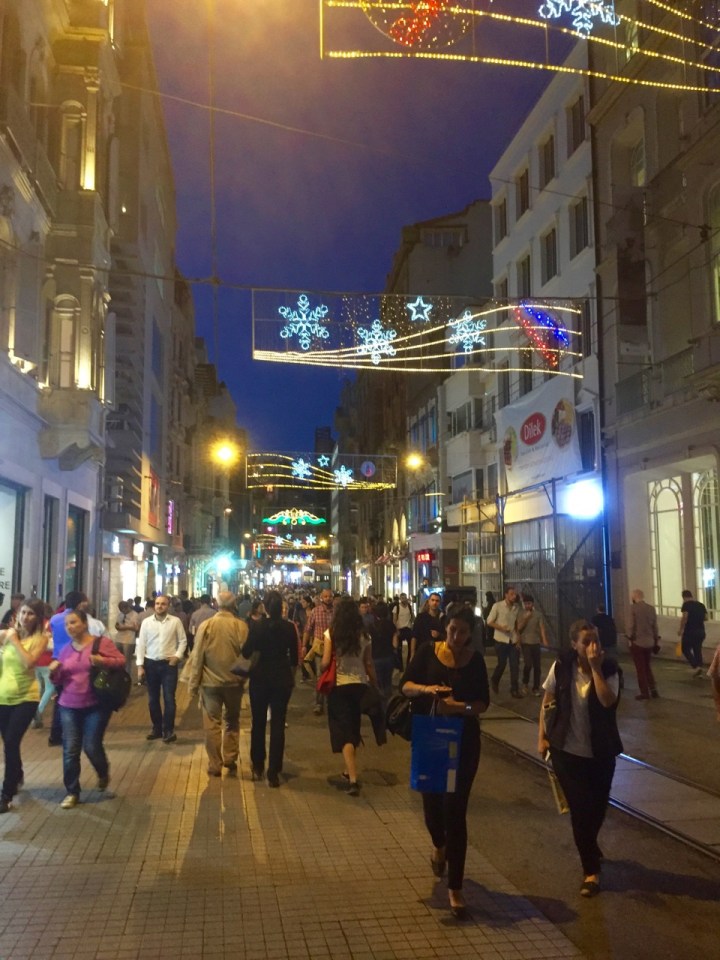 Main shopping street awash with people, late into the night