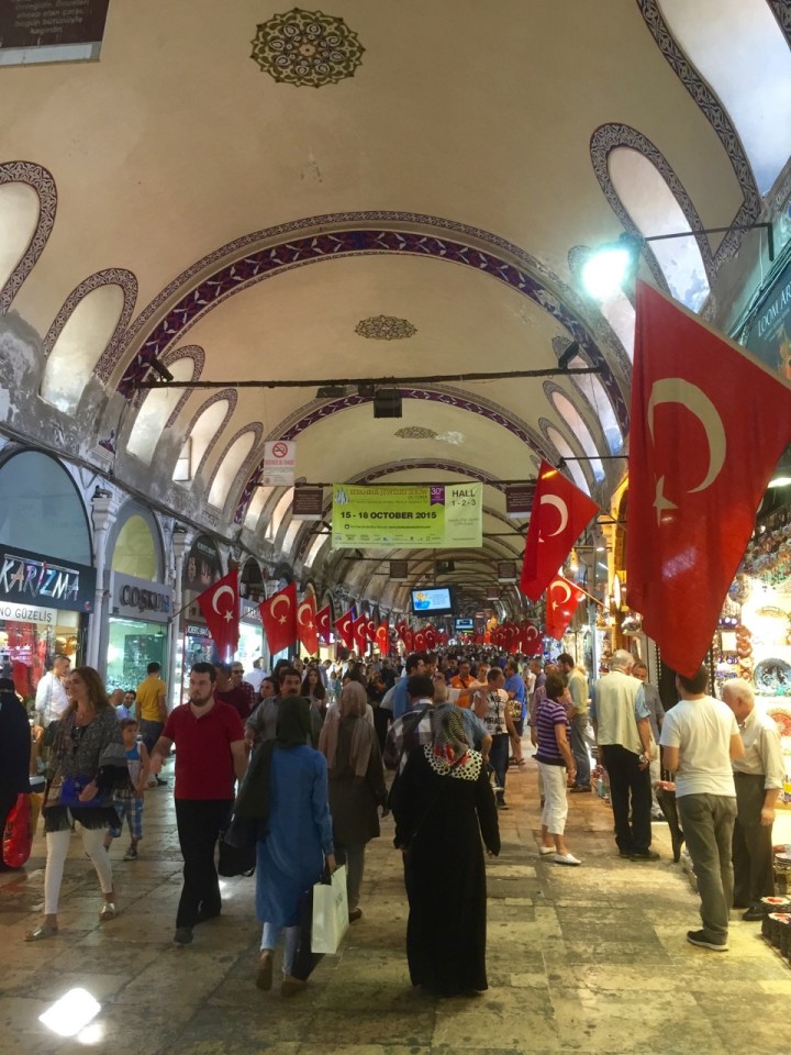 Main 'street' in bazaar, lots of flags