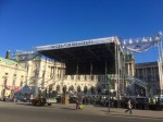 Stage being set up or taken down near palace; concert for refugees?