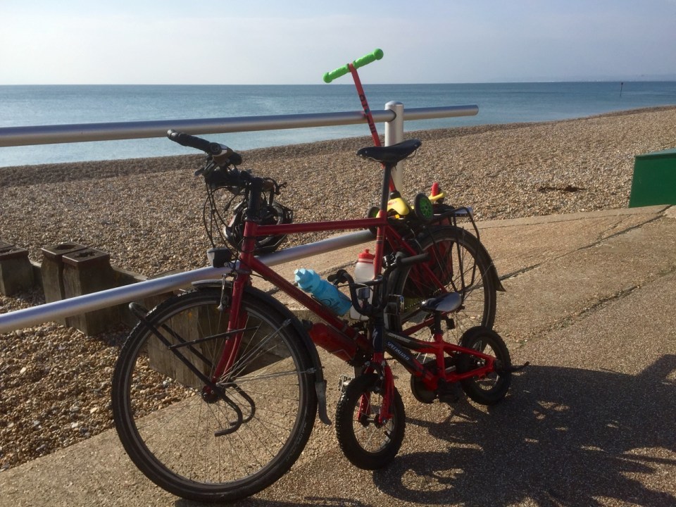 Smaug making friends with niece and nephew's vehicles