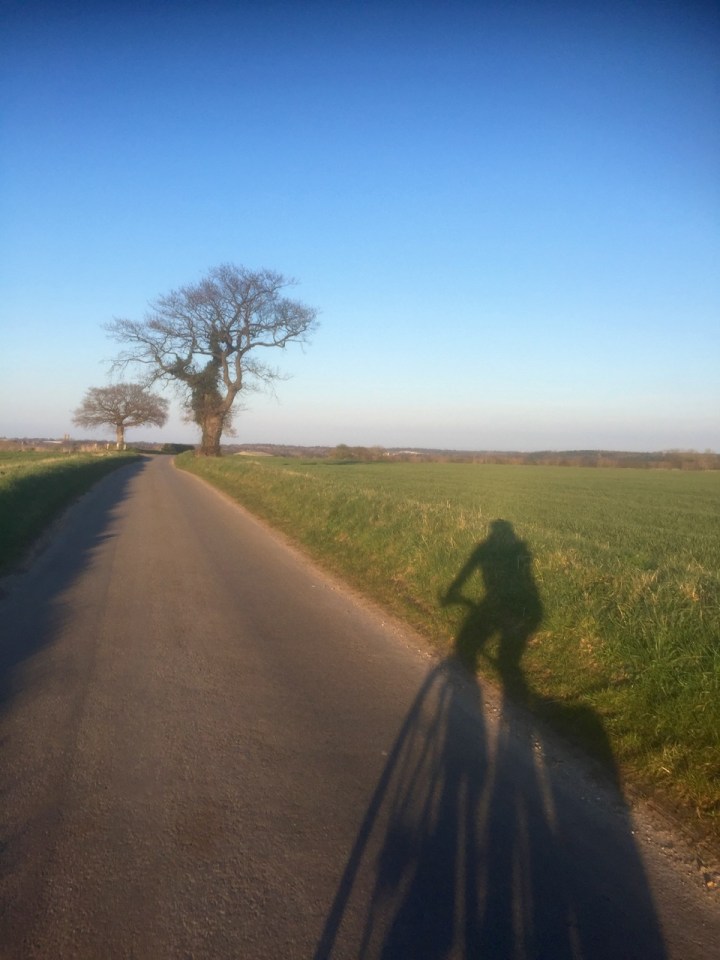 Me cycling with my shadow