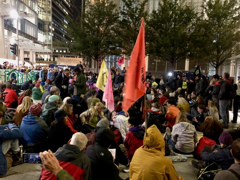 Numbers gather, with drumming and banners